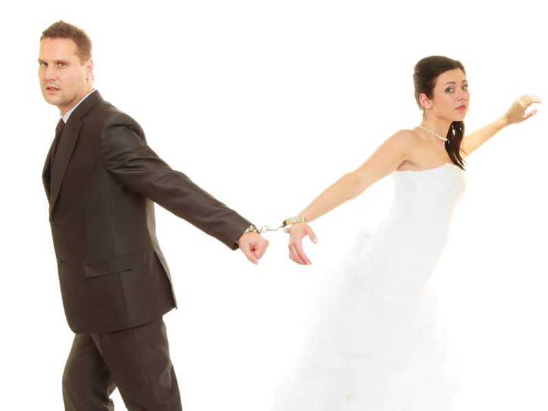 Bride and groom in handcuffs