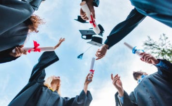 The Cost of Higher Education: How to Finance Graduate School college students celebrating