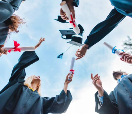 The Cost of Higher Education: How to Finance Graduate School college students celebrating