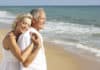 Why You Should Retire by the Beach older couple at the beach
